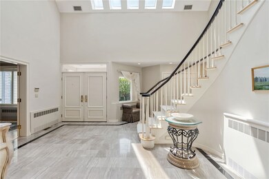Marble floors 2 story sunlit foyer