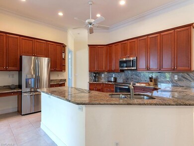 Kitchen with light tile patterned floors, stainles