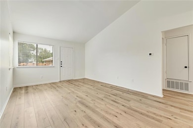 Unfurnished room featuring light wood finished fl