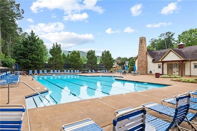 Community pool featuring a patio