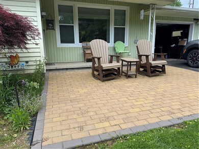 Front patio with attached 2 car garage