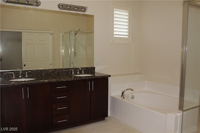 Full bathroom featuring a stall shower, a bath, an