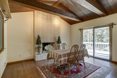 Cozy up around the charming brick mantle fireplace