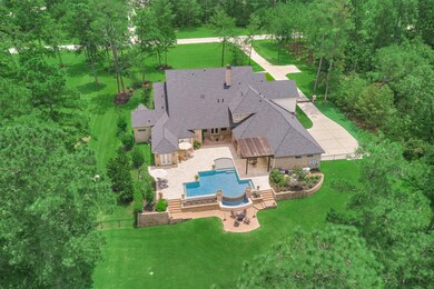 This is the backyard you have been searching for.  A gorgeous pool, outdoor kitchen, fireplace and pool bath. This is a wonderful space to relax and enjoy watching the deer on the property.