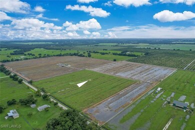 Birds eye view of property with a rural view
