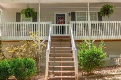 View of exterior entry with covered porch