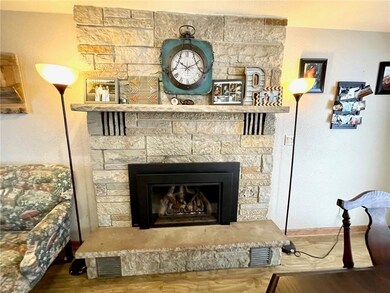 Stone natural gas fireplace in the dining room area!