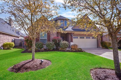 The front door entry has nice cedar columns with stone.
