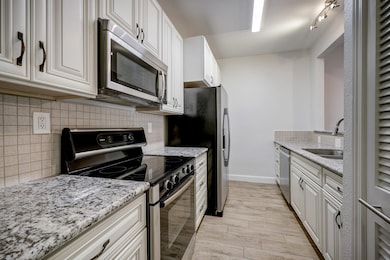 Beautiful cabinets, lovely granite countertops and