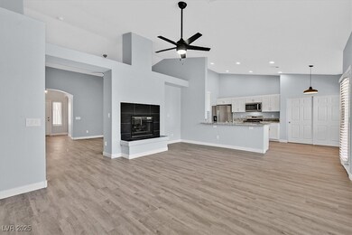 Unfurnished living room featuring high vaulted cei