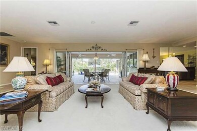 Living Room from foyer out to the pool area.