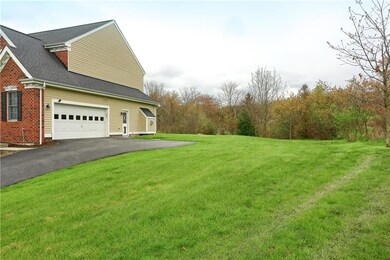 Side Entry 2 Stall garage w/interior bump back to fit trash cans, lawn mower or whatever you need.  Complete with Service door and Pet door built in.  Invisible Fence is installed, but owner cannot verify that it works because they never used it.  Th