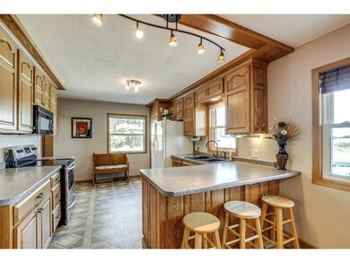 Custom cabinetry, ample counter top space & a brea