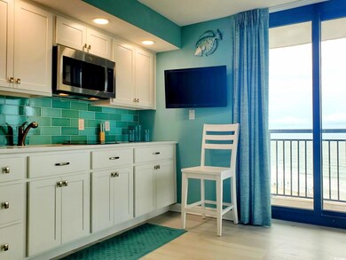 Kitchen with light hardwood / wood-style flooring,