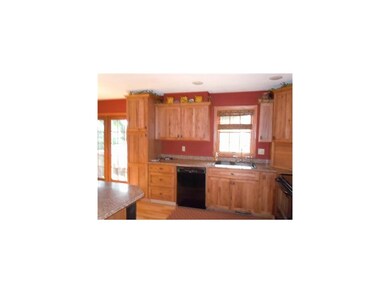 Kitchen. Beautiful hickory cabinets in this update