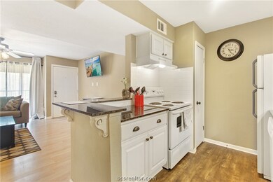 Kitchen opens to living and dining