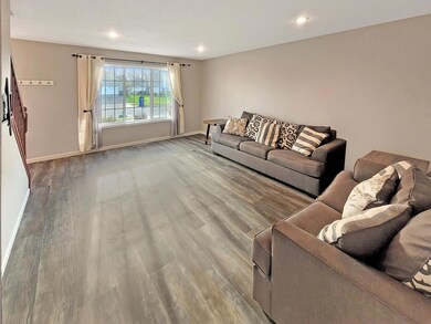 Roomy living room with large bright windows.jpg