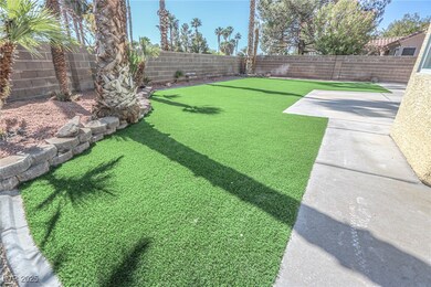 View of yard featuring a fenced backyard and a pat