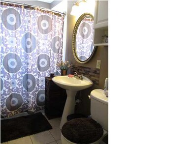 BATHROOM HAS BEEN UPDATED WITH VANITY SINK, GLASS 