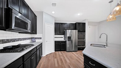 Matte Tile backsplash, gas cooktop, double ovens,