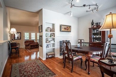 The dining room has a fireplace and extra shelves 
