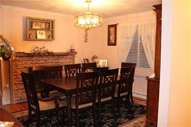Diningroom main floor with gas fireplace and hardw