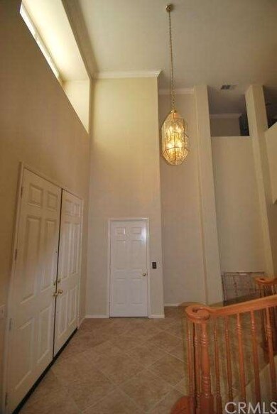 The door straight ahead is the elevator.