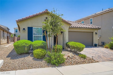 Mediterranean / spanish home with a garage, stucco