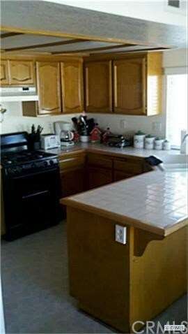 Lovely SUNNY kitchen with stove and stainless dish