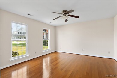 Spare room with visible vents, baseboards, a ceili