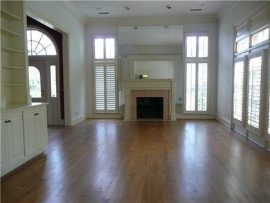 Light filled living room offers gorgeous hardwood 