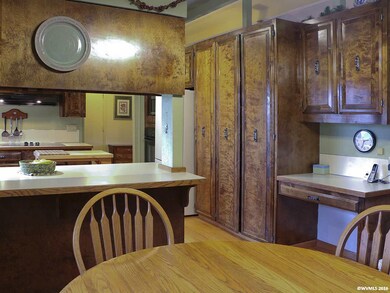 Breakfast Nook and Kitchen with pantry cabinets an