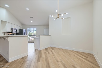 Kitchen featuring light wood-style flooring, light