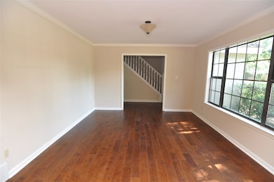 A formal living room is located just off the foyer