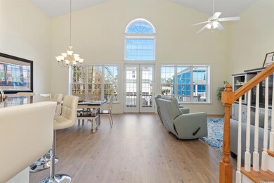 Living room featuring ceiling fan with notable cha