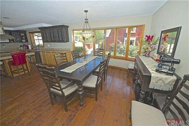 THE DINING ROOM TABLE SETS INTO A ARCHED WALL OF B