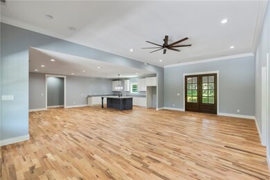 Double doors open to covered porch.
