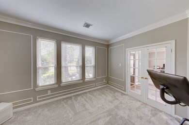 Alternate view of the study - the wall of windows overlooks the front of the home