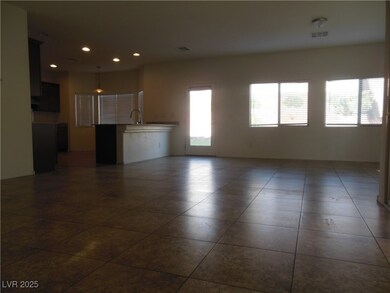 Unfurnished living room featuring dark tile patter