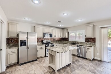 Kitchen featuring a sink, appliances with stainles