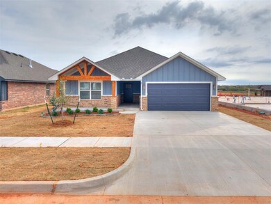 Craftsman house with a garage, brick siding, board