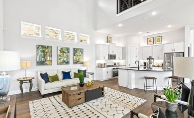 Living room with a high ceiling, hardwood / wood-s