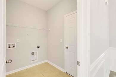 Washroom with hookup for an electric dryer, washer