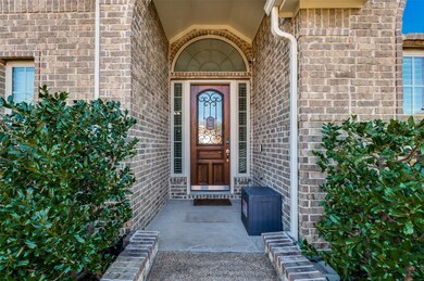 View of exterior entry with brick siding