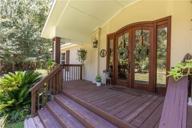 View of exterior entry featuring stucco siding and