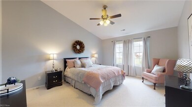 This spacious master bedroom have vaulted ceilings