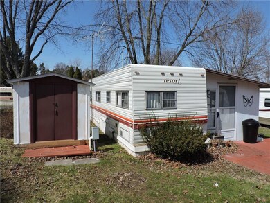 Rear Exterior, Shed and all contents (table, chair