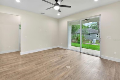 Large slider leads to a covered back porch.