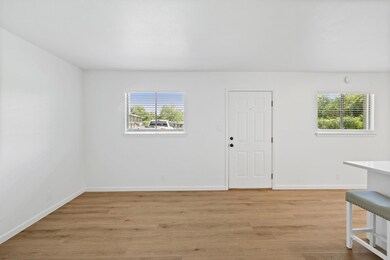 Foyer entrance with plenty of natural light, base