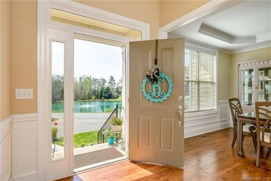 Foyer with views of stocked pond. Come enjoy the s